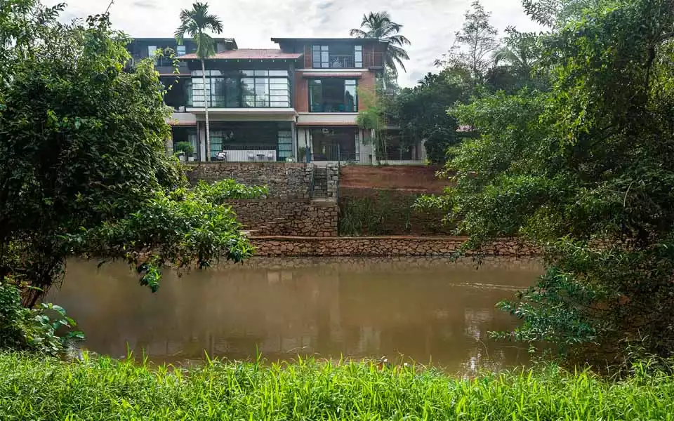 House with a river in front