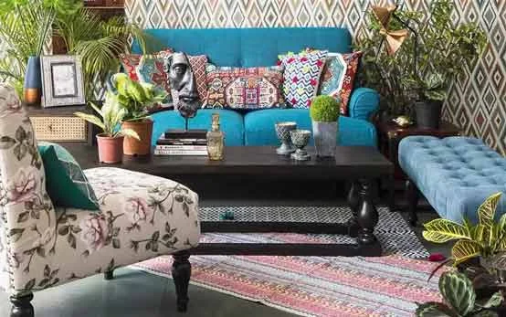 Rug design ideas for living room with blue sofa and a centre table - Beautiful Homes