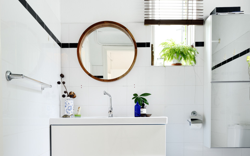 Clever use of walls space in small bathroom designs: floating shelves, cabinetry, hanging hooks etc.
