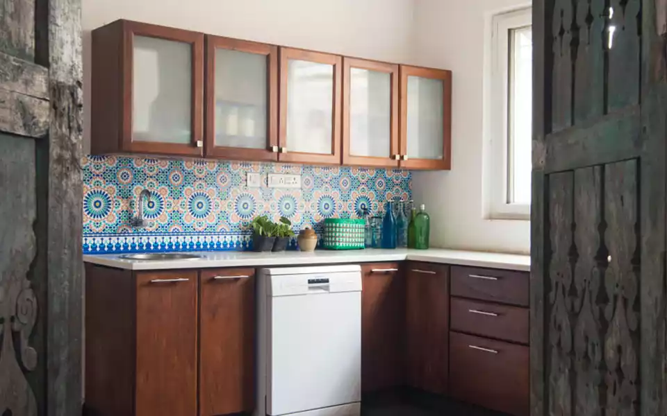 Colourful kitchen tile design on a small wall area