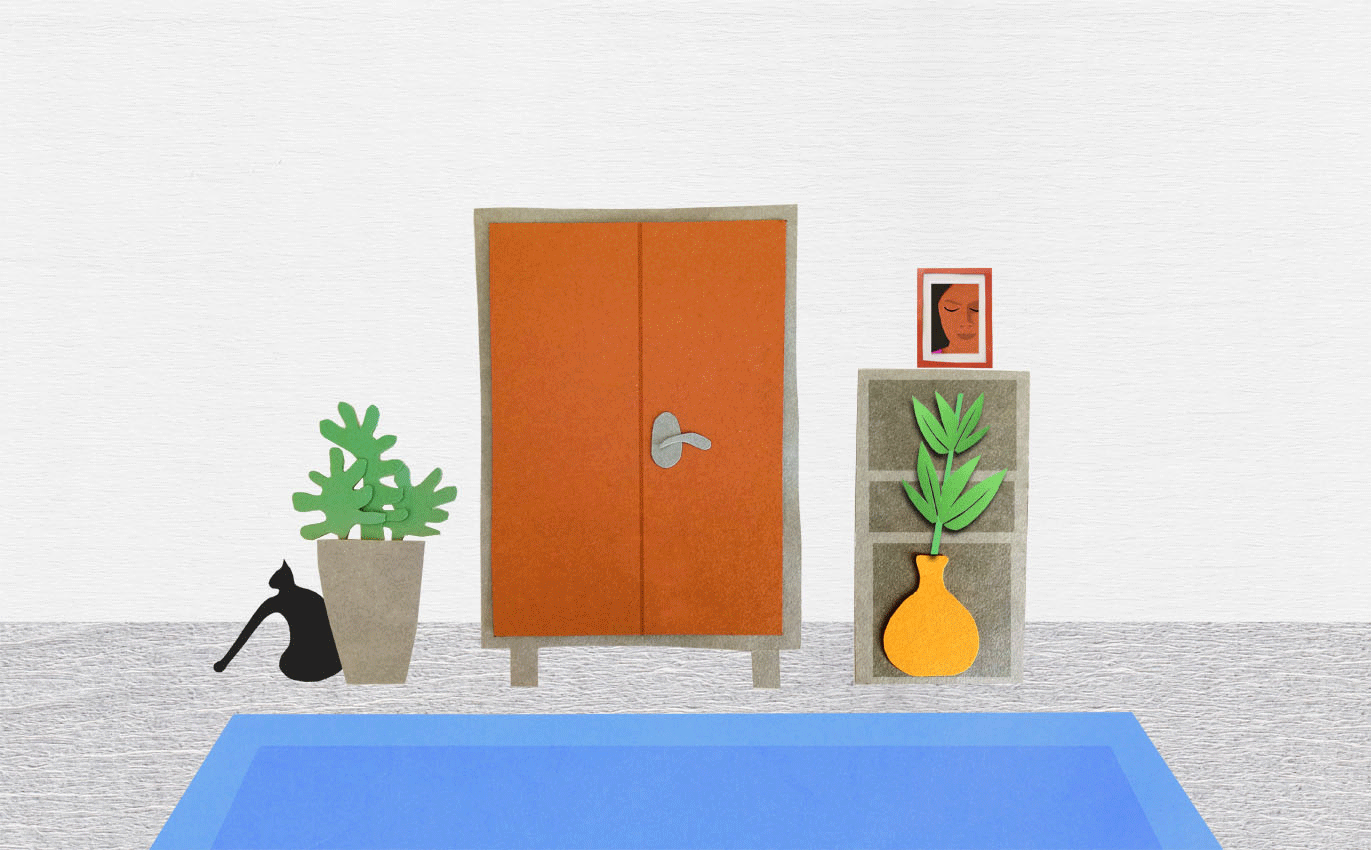 Animated gif with a colourful Godrej almirah opening and a cat