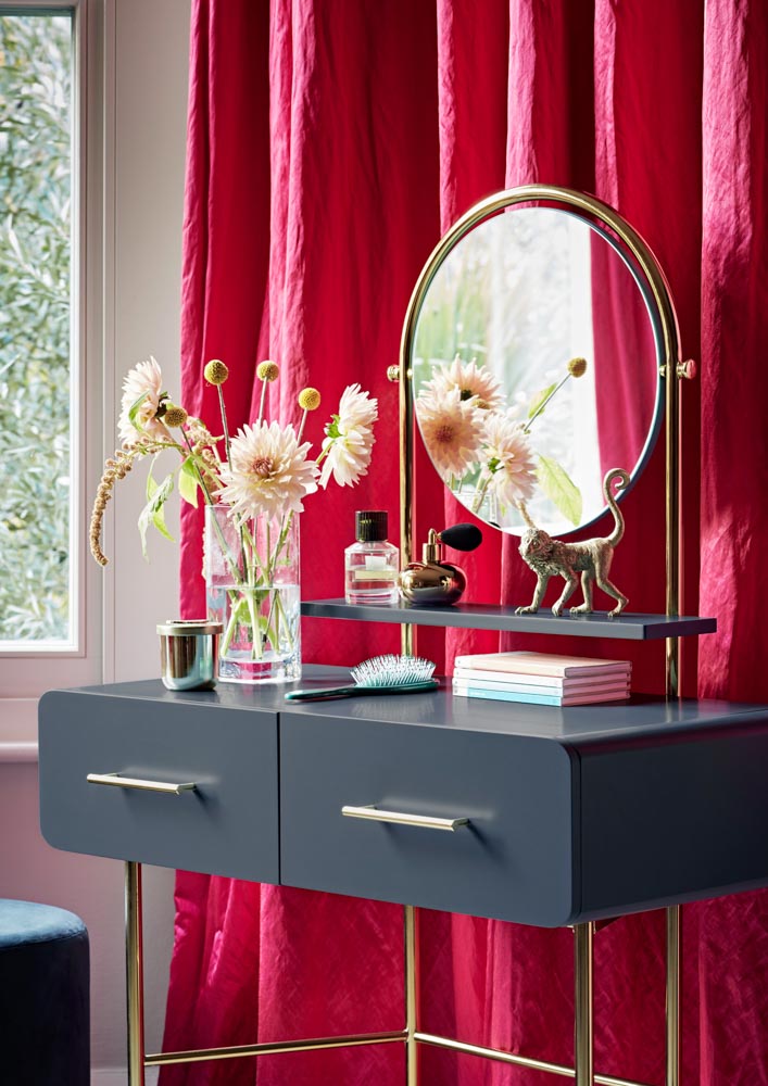 Girls dressing table with mirror in soft grey with drawers and gold rails in bedroom interior - Beautiful Homes