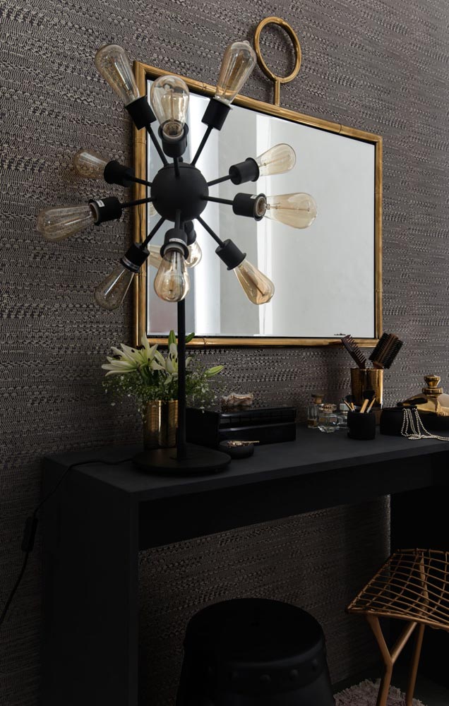 Sleek dressing table in black with gold accents, large mirror and multi-lightbulb lamp for bedroom interiors - Beautiful Homes