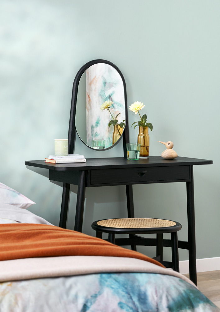 Simple bedroom dressing table with mirror in black with a drawer and subtle ornaments - Beautiful Homes