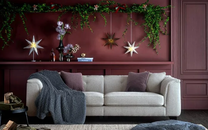 Minimalist&rsquo;s living room design for Christmas with a wreath on a door   - Beautiful Homes