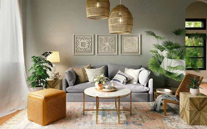A living room with a grey sofa, two planters, a carpet and a centre table