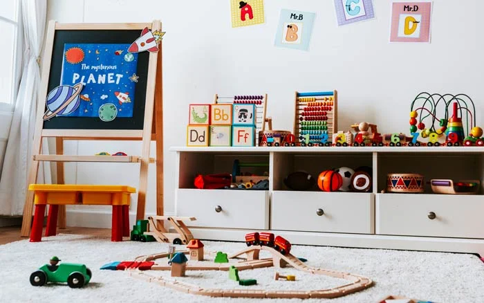 A kids play room with a lot of toys