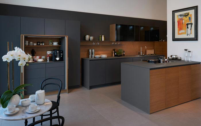 Kitchen design with glass storage cabinets to store crockery &amp; keep it neat - Beautiful Homes