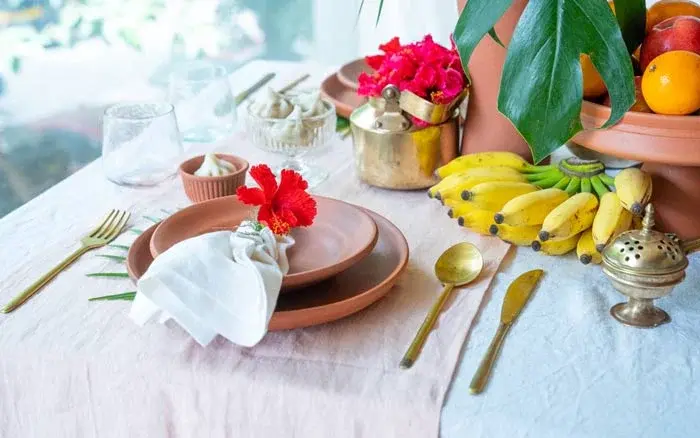 Table decoration for Ganesh Chaturthi with traditional copper pooja items &amp; offerings - Beautiful Homes