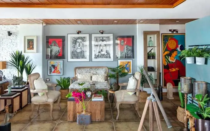 Maximalist living room design with wooden furniture, art &amp; indoor plants - Beautiful Homes