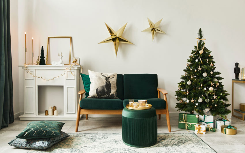 Living room with a green sofa and Christmas décor