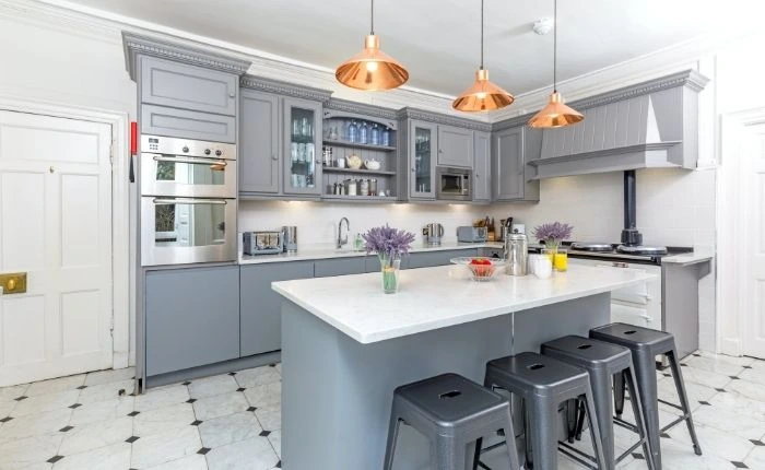 While &amp; grey kitchen interior design with island layout as breakfast counter - Beautiful Homes