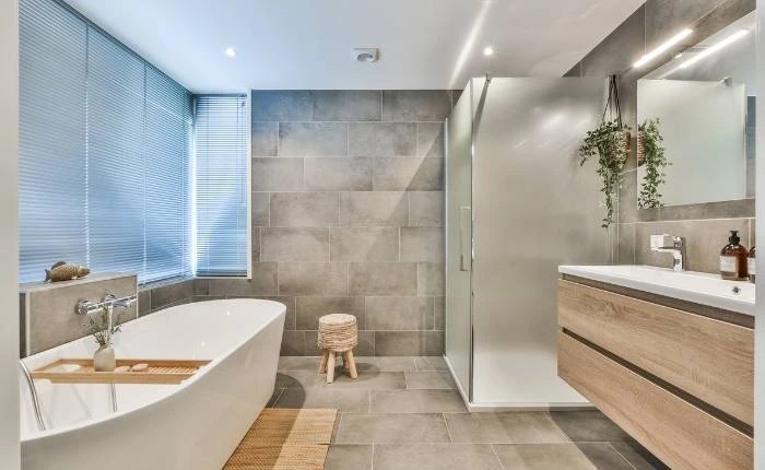 Spacious modern bathroom interior design with a bath tub &amp; vanity - Beautiful Homes