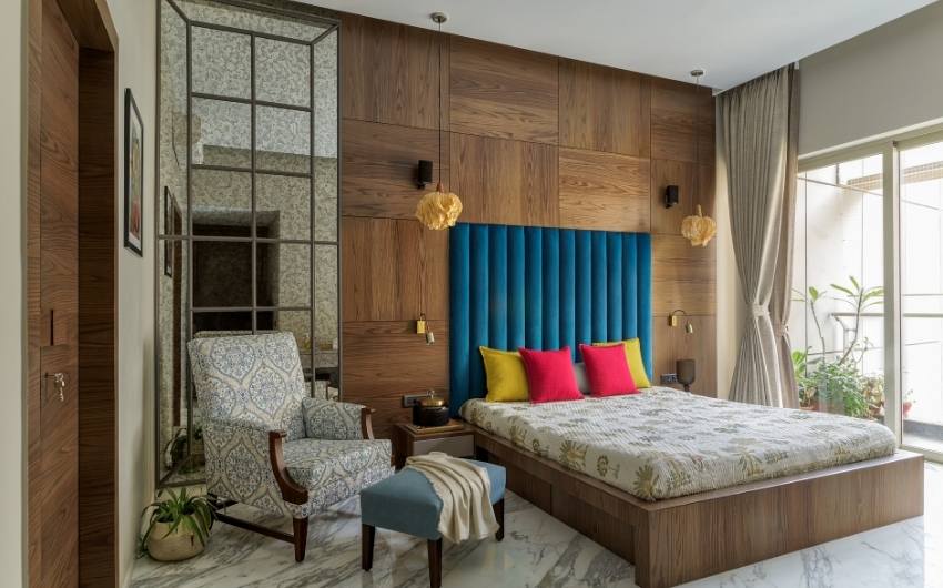 Bedroom design with wooden finish furniture & colourful furnishings - Beautiful Homes