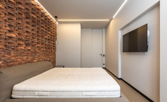 Brick wall for bedroom design with platform bed - Beautiful Homes