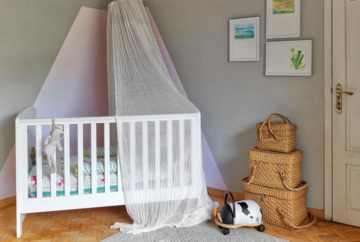 Nursery with white crib and little décor